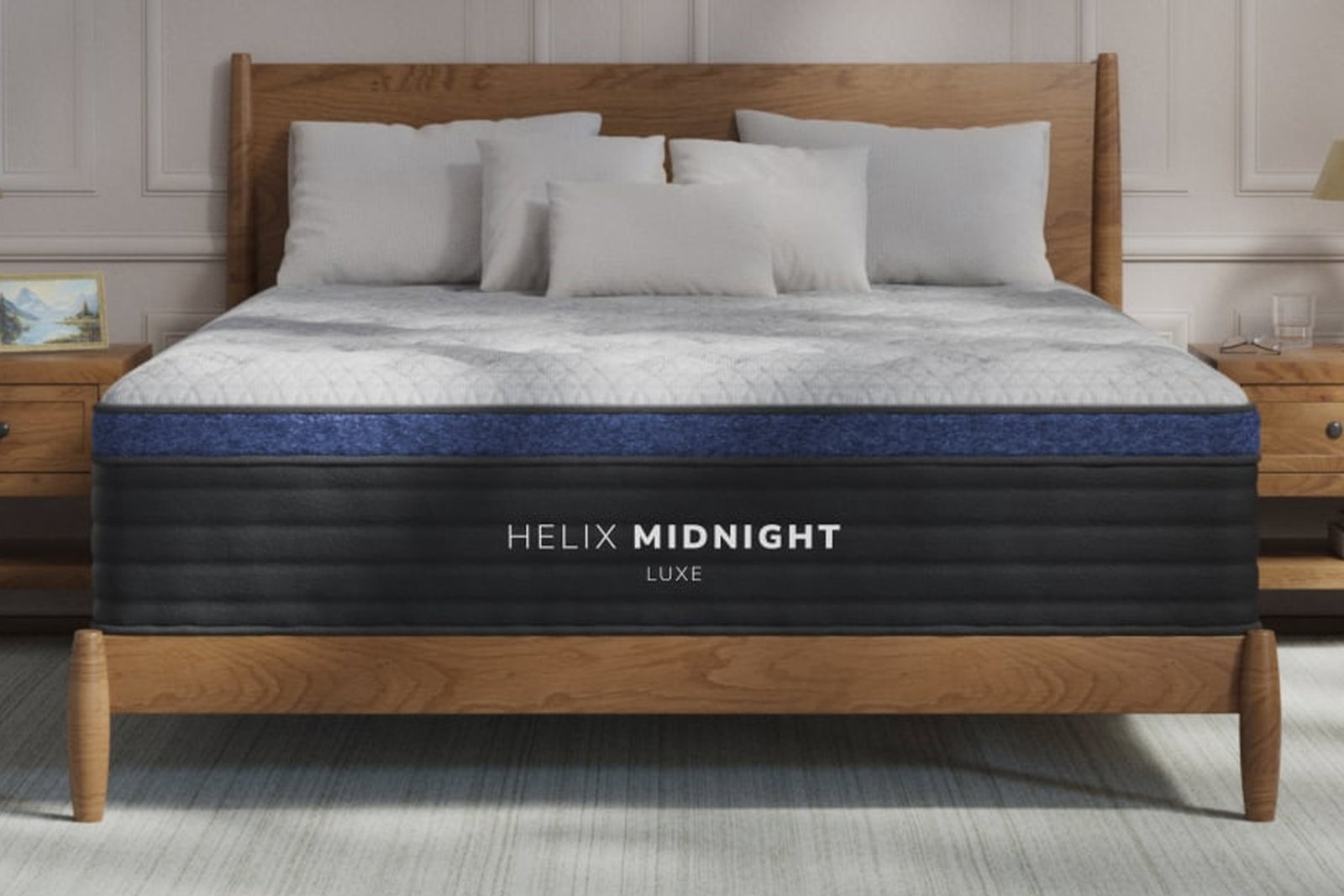 Helix Midnight Luxe hybrid mattress on a wood bed frame in a styled bedroom